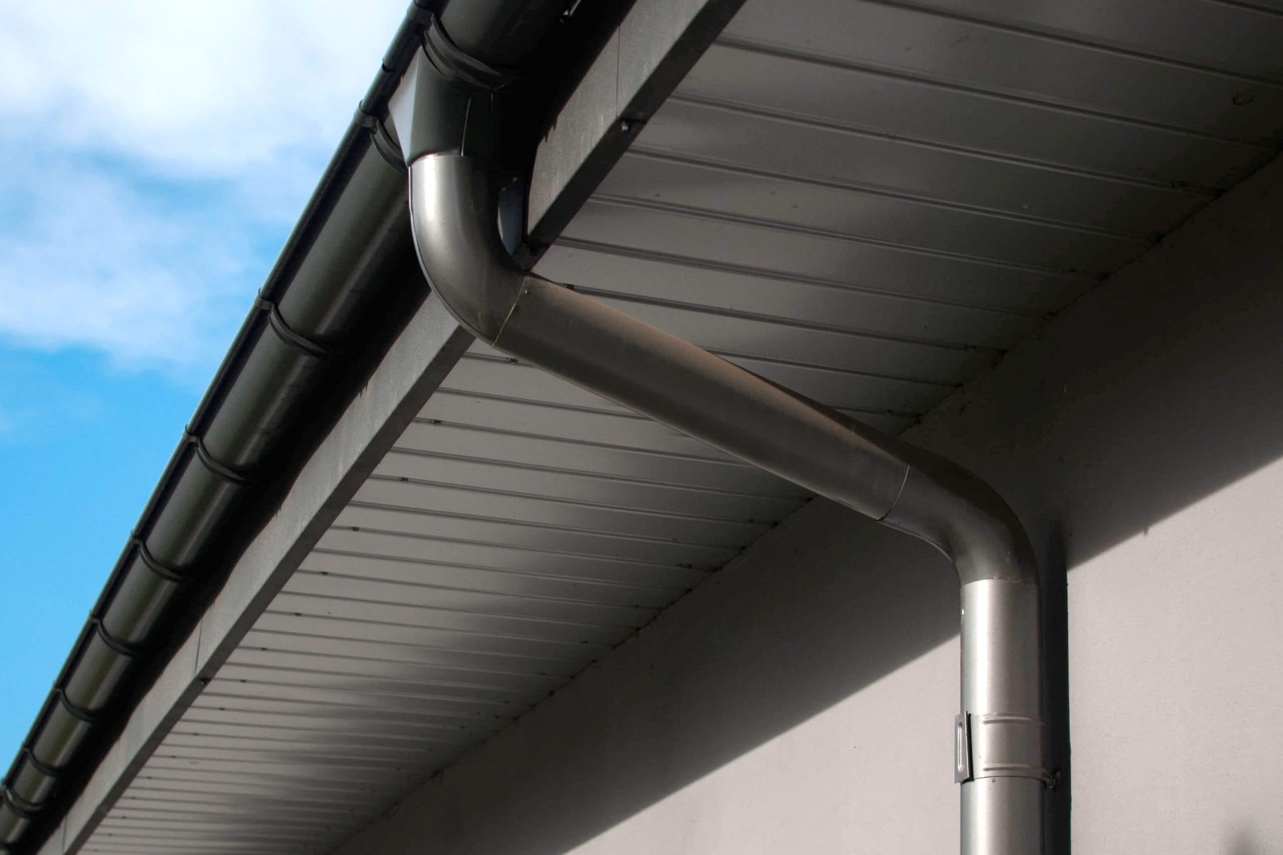 Corrosion-resistant galvanized gutters installed on a commercial building in Vancouver